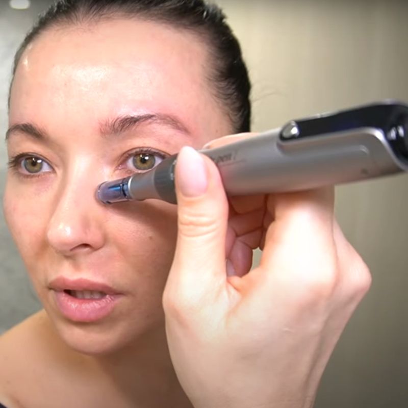 Dr_Pen_Microneedling_pen_in_use_on_under_eye
