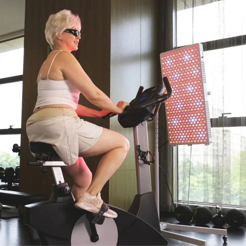 Largest_TGA_Approved_Red_Light_Panel_infront_of_lady_2