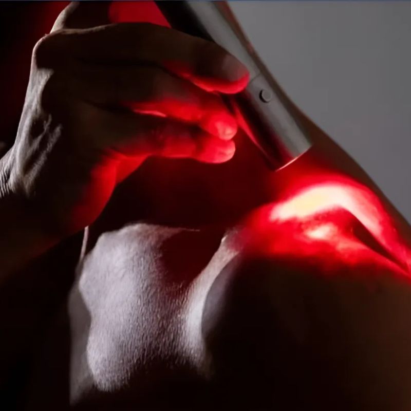 Red Light Therapy Torch on shoulder