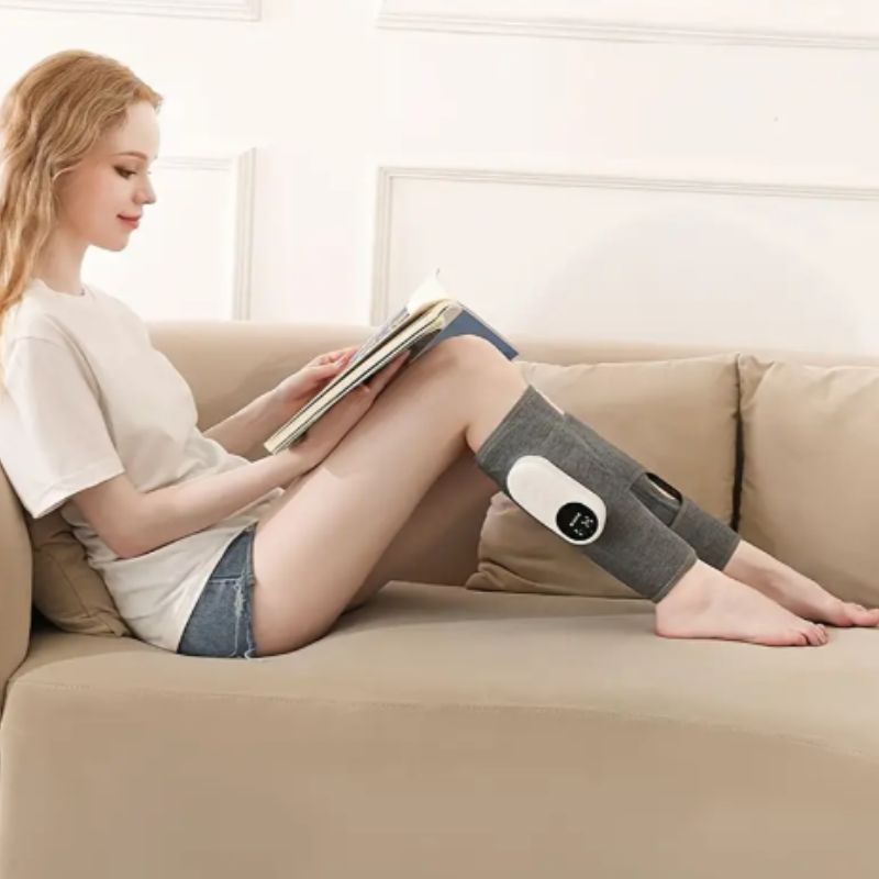 calf massager in use with woman reading