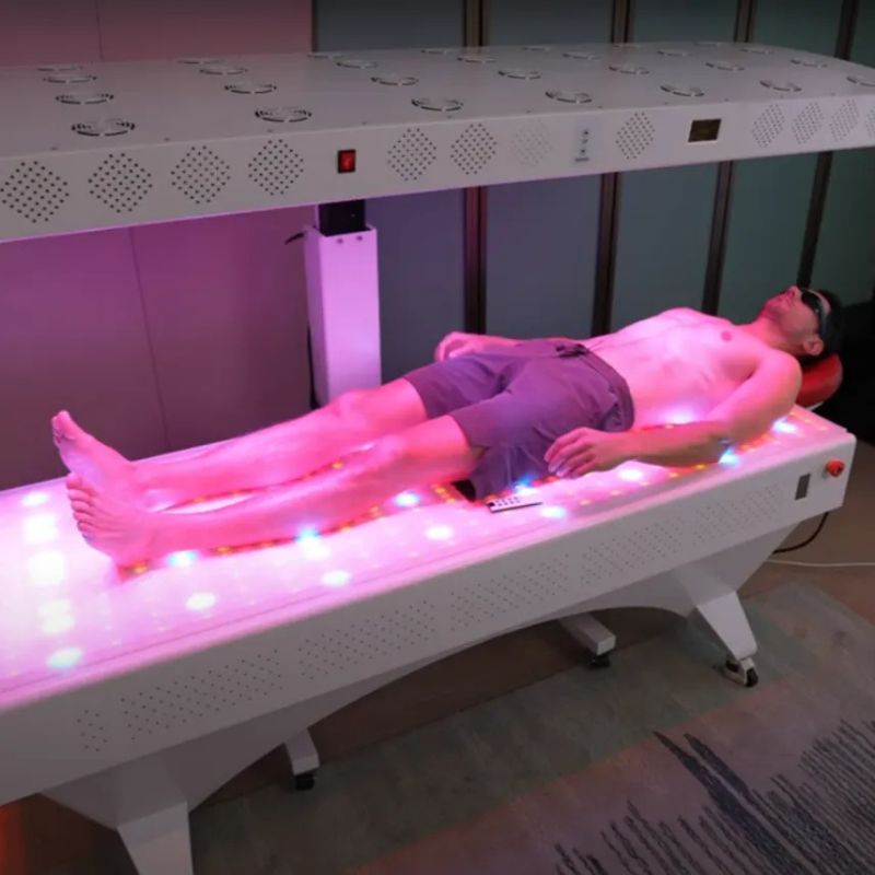 man_laying_in_commercial_red_light_therapy_bed