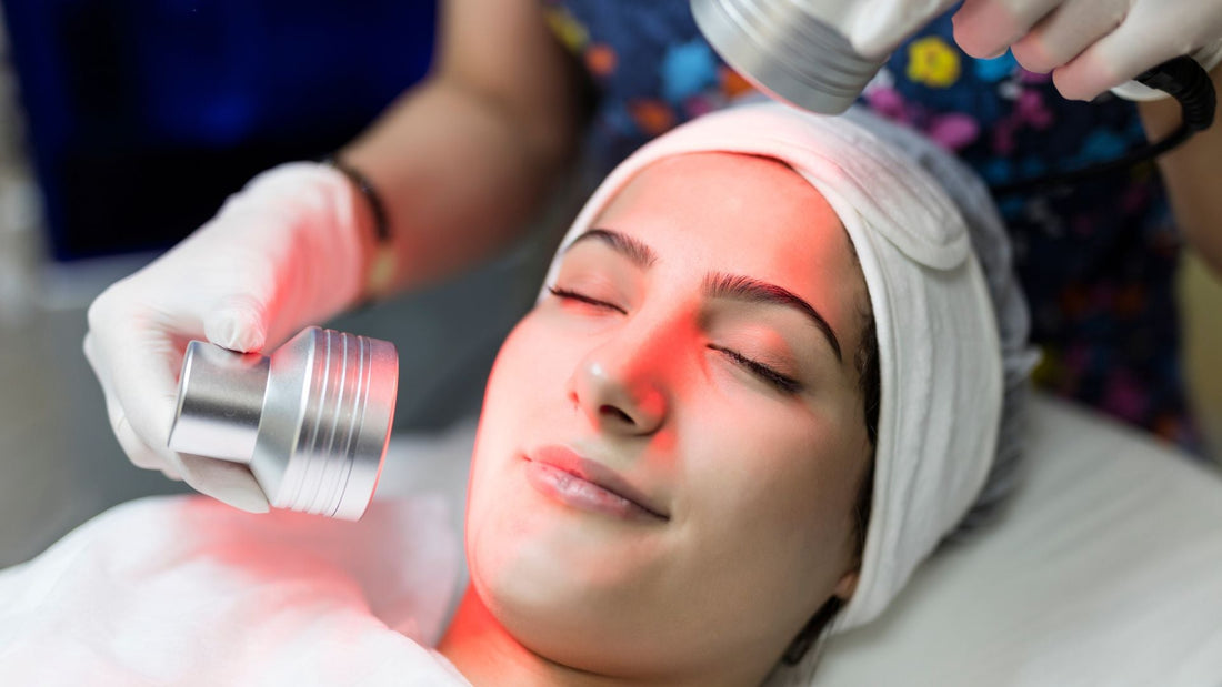 Lady having a red light lamp on her face