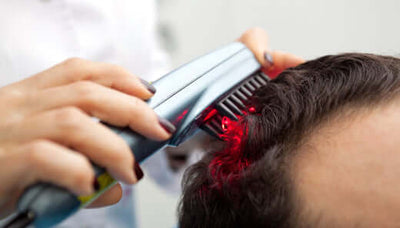 red light therapy brush in use