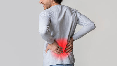 man with hands on back with red glow