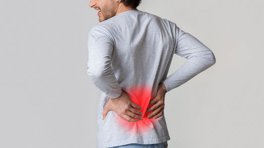man with hands on back with red glow