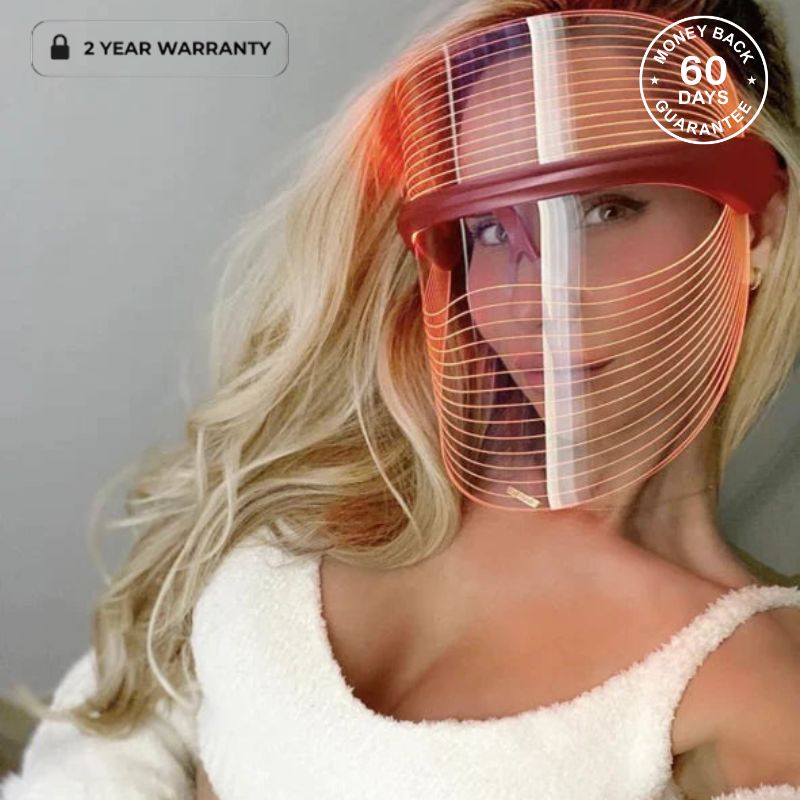 Woman Using light therapy mask wearing a white top