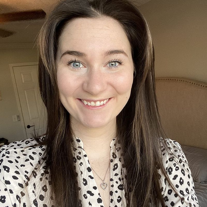 Woman Staring into Camera Smiling