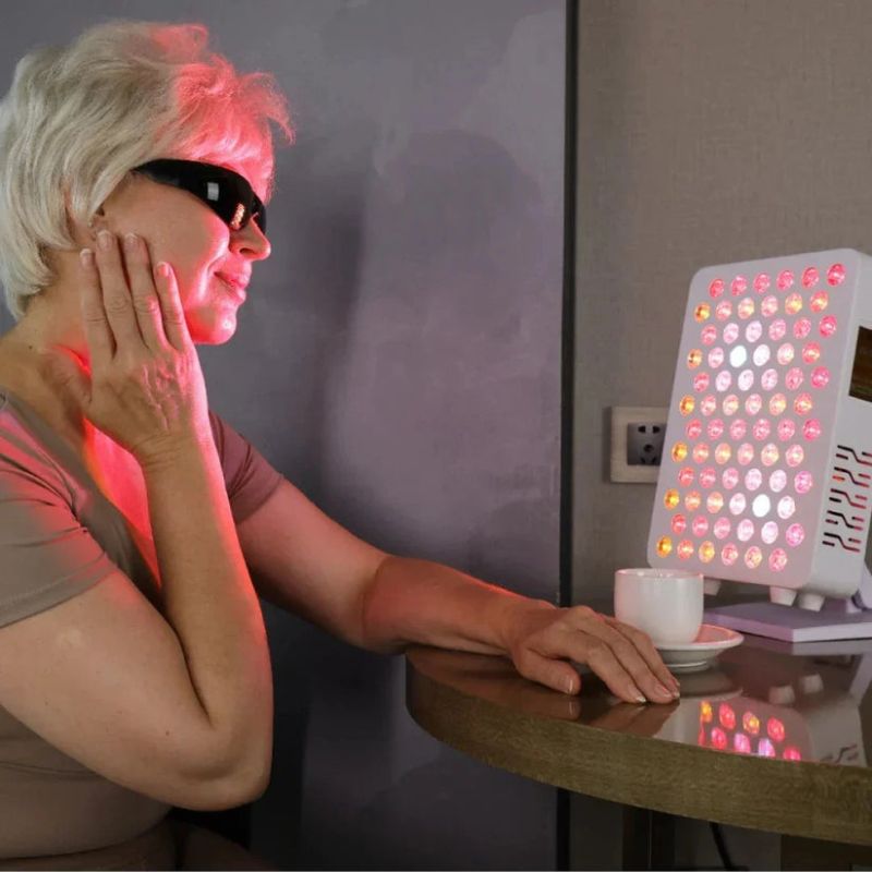 Woman_Staring_into_red_light_panel