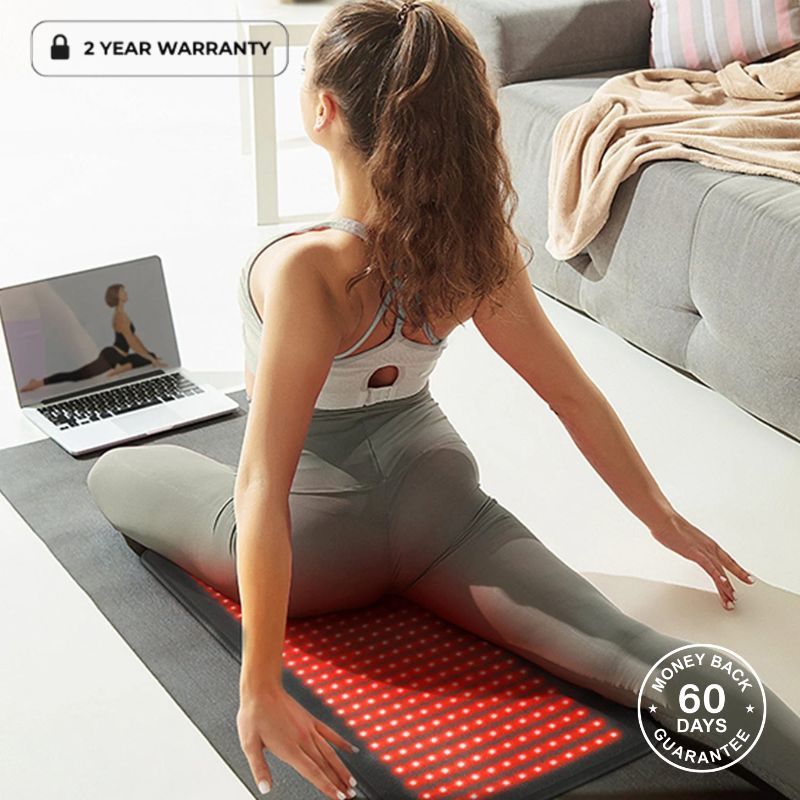 Woman Stretching On Red Light Therapy Mat