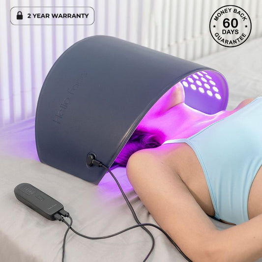 Woman Underneath light therapy machine with purple light