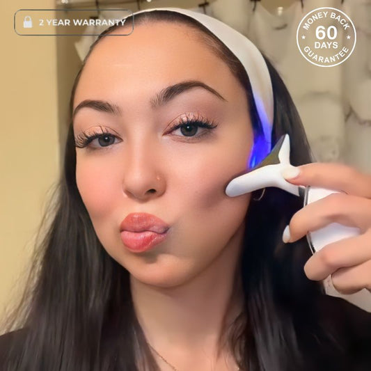 Woman Using LED Face Sculpting Tool On Face