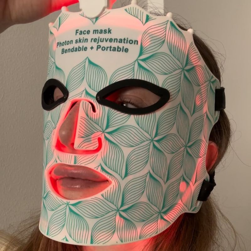 Woman Wearing Green Colour Red Light Mask