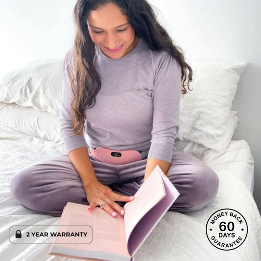 Woman_reading_book_whilst_wearing_pink_period_massager
