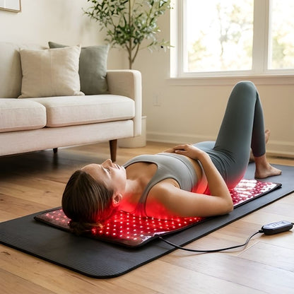 Woman_laying_on_red_light_therapy_wrap_739dc9bc-e075-403a-b80b-8f085ed71d1e