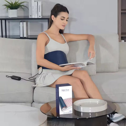 Woman_reading_a_book_with_a_red_light_therapy_pad_on_her_stomach_2
