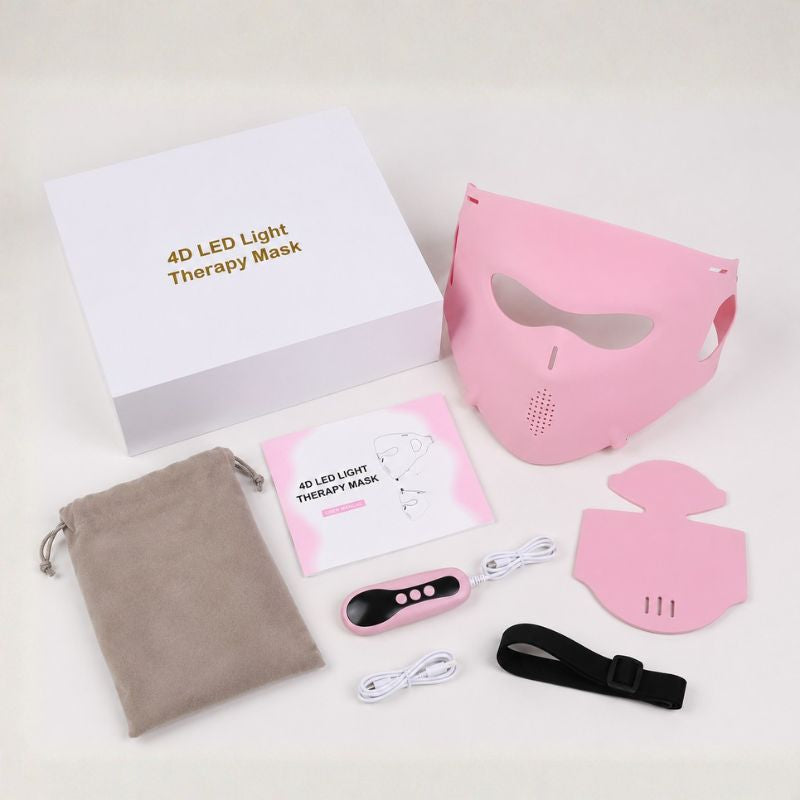 birds eye view of all contents of the led light therapy mask in pink