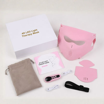birds eye view of all contents of the led light therapy mask in pink