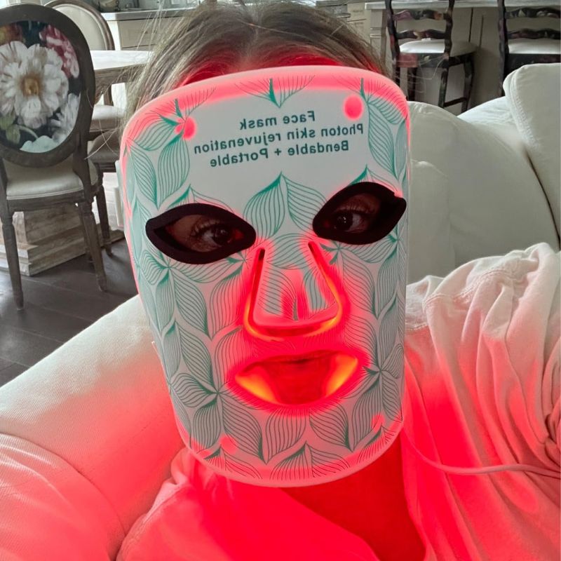 led light therapy mask in use in green