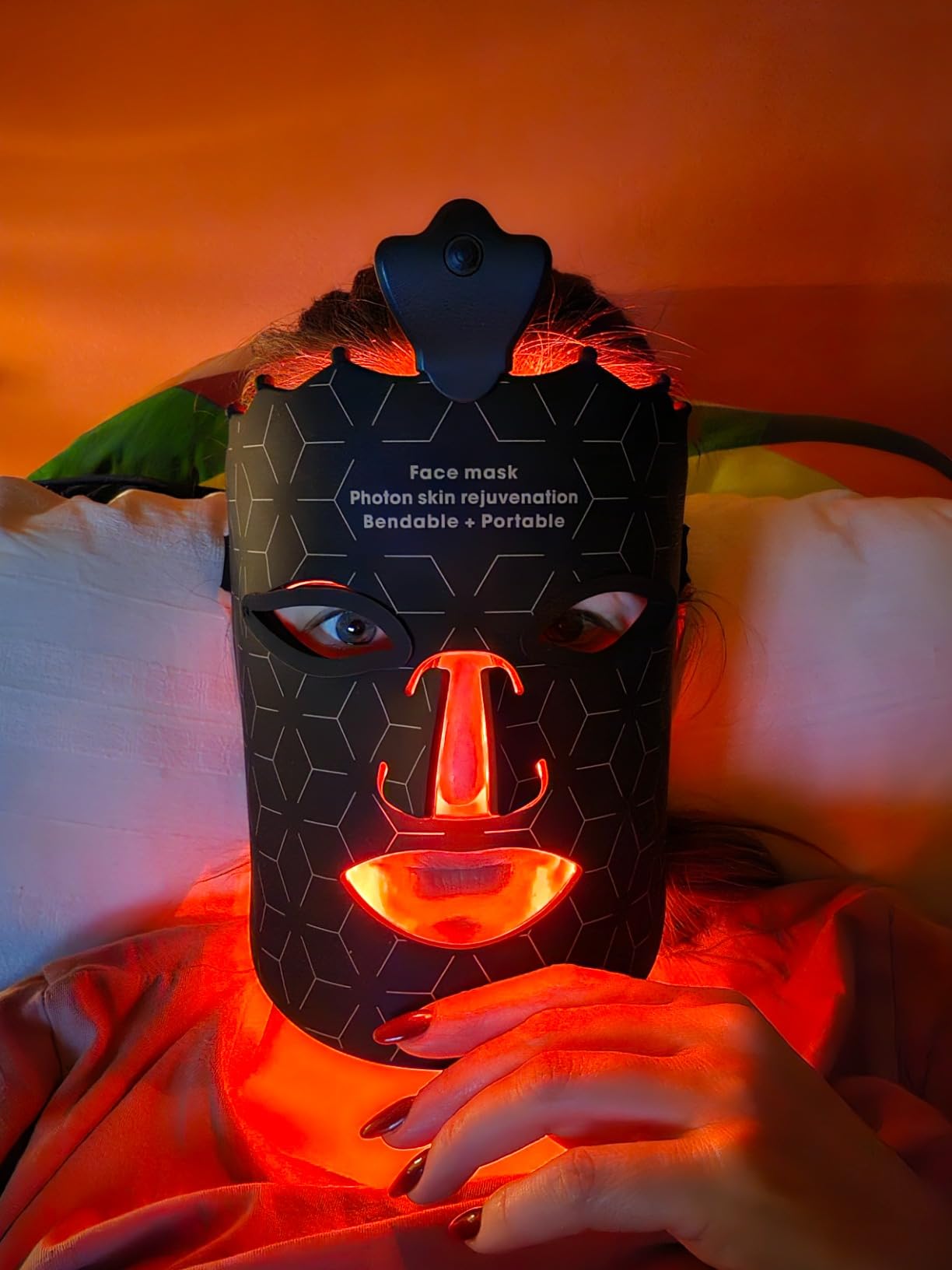 led light therapy mask in use in red