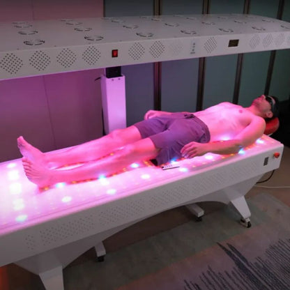 man_laying_in_commercial_red_light_therapy_bed