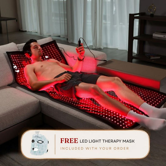 man_laying_on_red_light_therapy_laser_mat_1