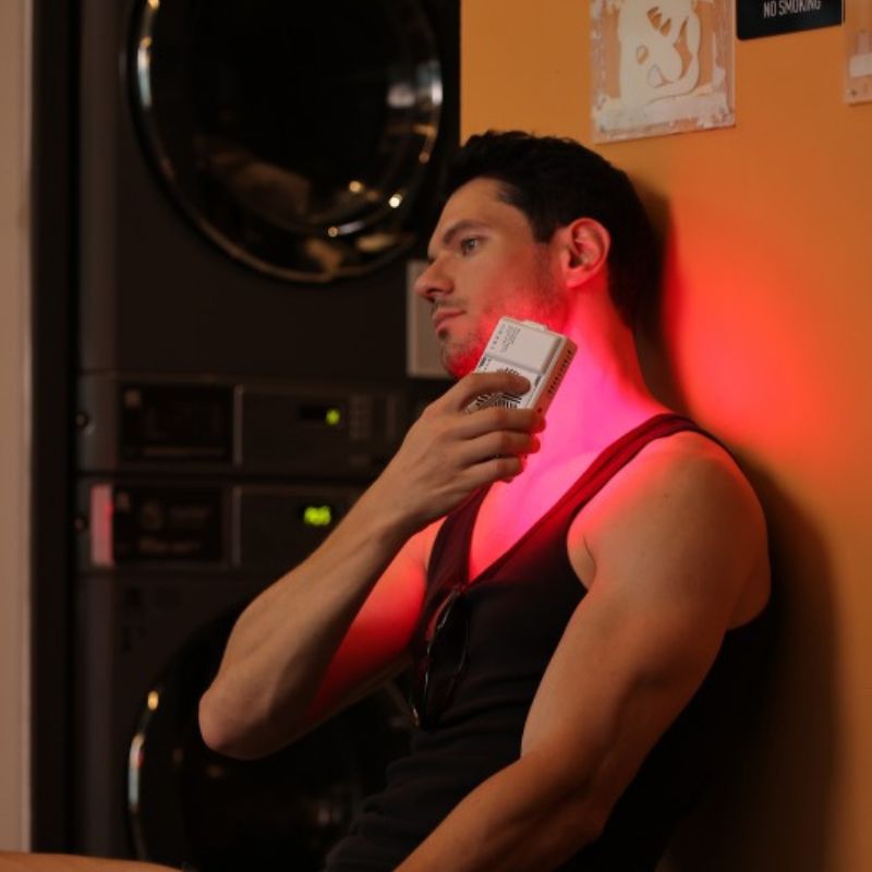 manholidngportableredlightpaneluptoneck