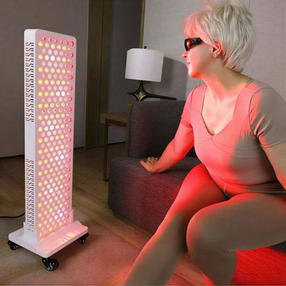 medicalgraderedlighttherapypanelss300withwomansittinginfrontofit