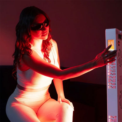 medicalgraderedlighttherapypanelss300withwomansittinginfrontofit2