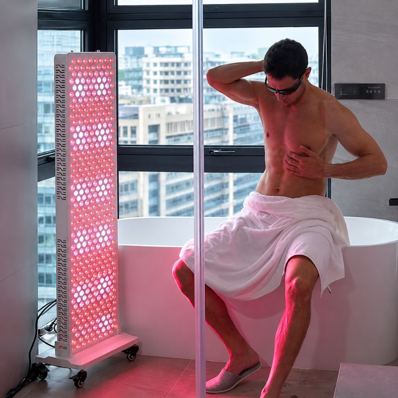 medicalgraderedlighttherapypanelss450promanstretchinginfrontofpanel