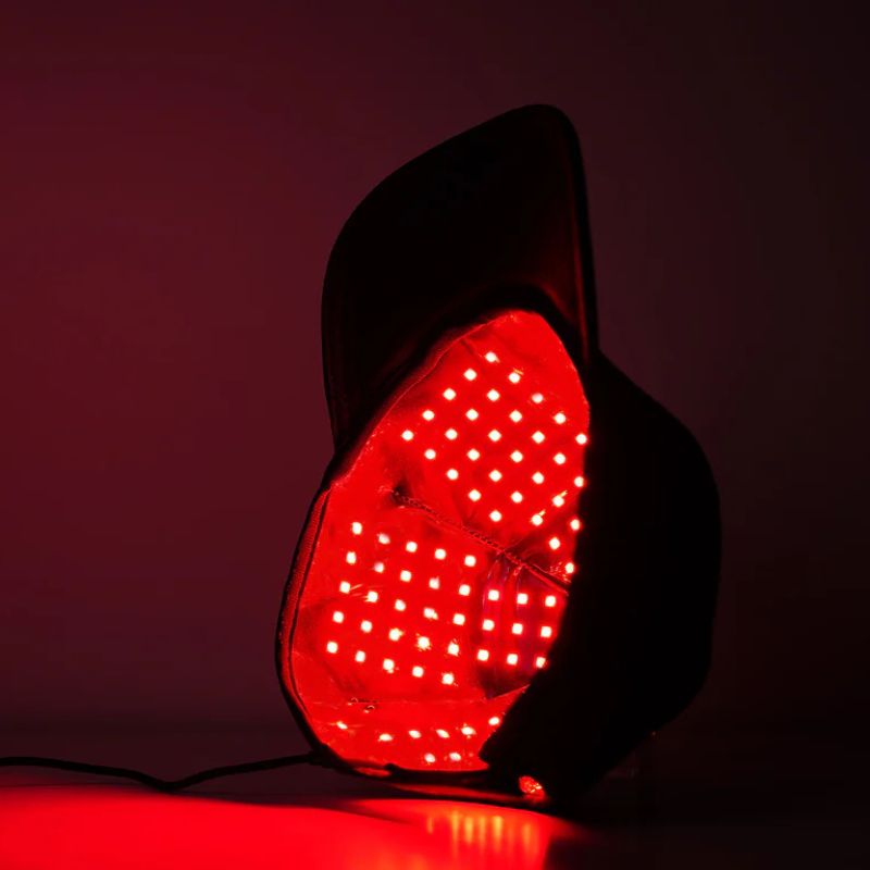 side_view_of_red_light_therapy_cap_with_dim_background